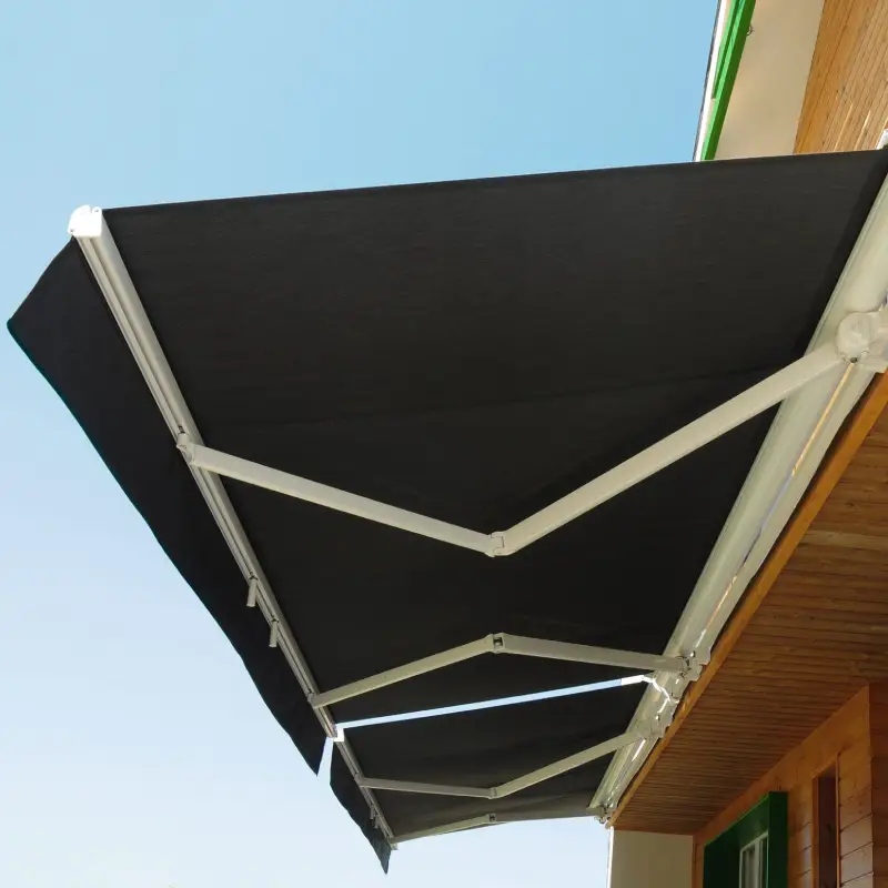 A black awning is attached to the side of a building.